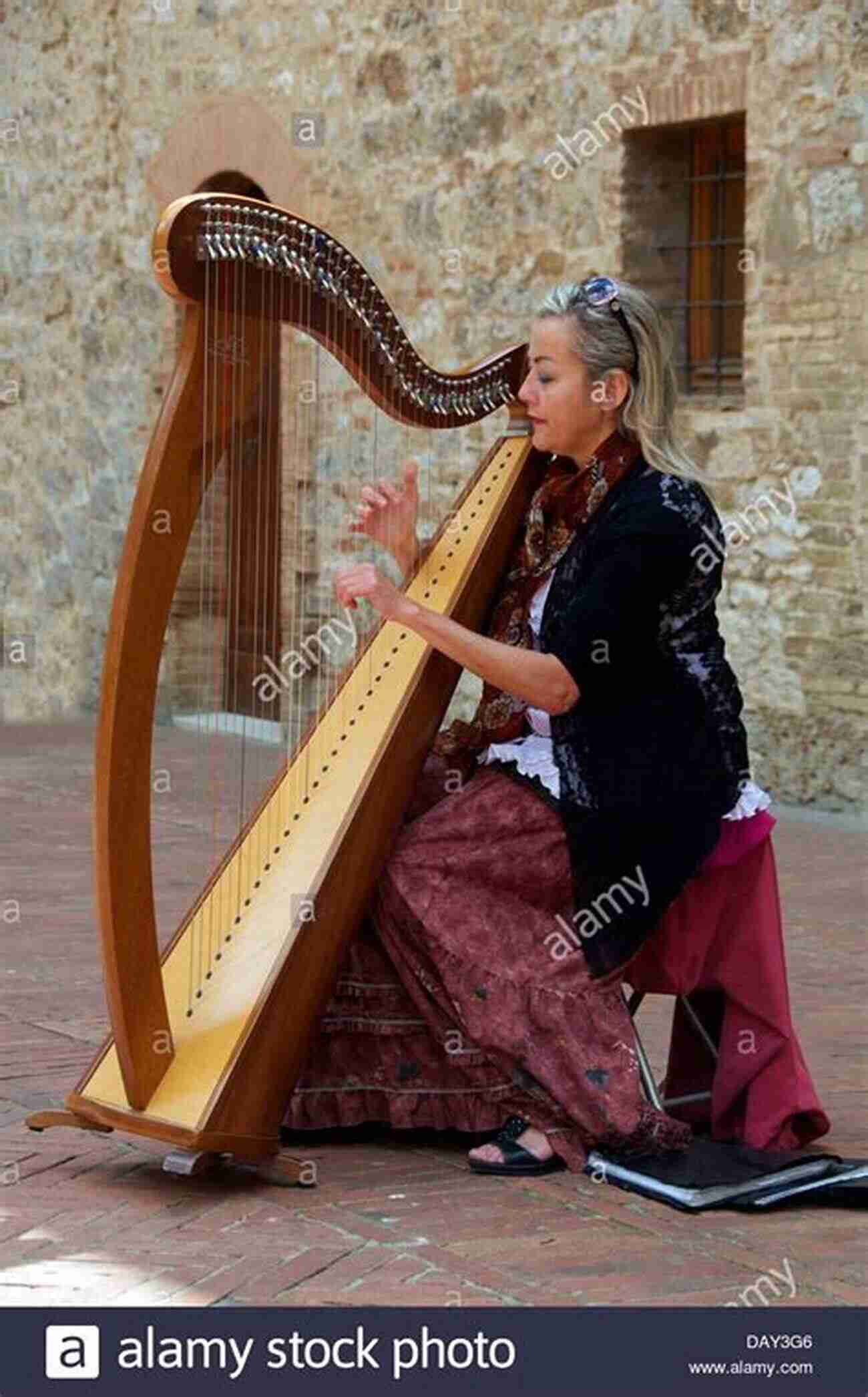 A Woman Gracefully Playing The Harp How To Play The Harp: Basic Guide For Beginners