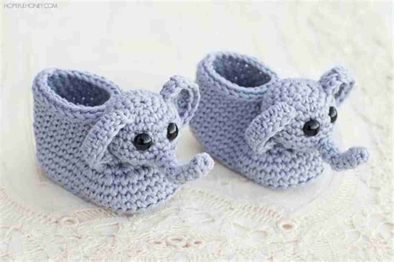 Baby Wearing Crochet Booties With Animal Print Crochet Pattern Baby Booties With Animal Print: Crochet Pattern