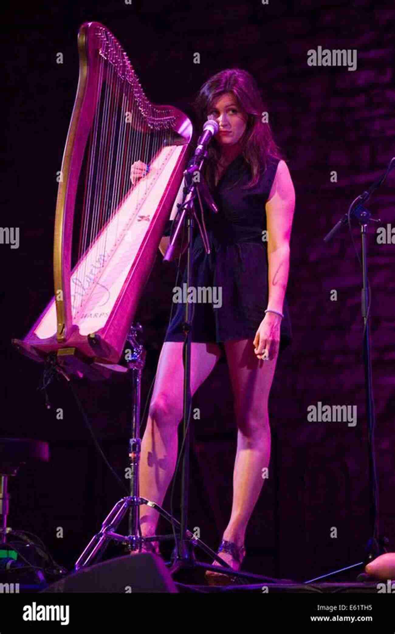 Harpist Performing On Stage How To Play The Harp: Basic Guide For Beginners